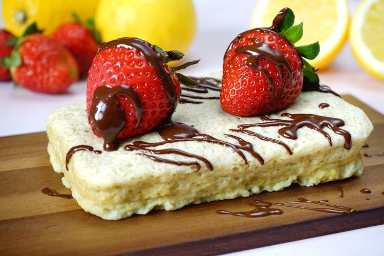 Strawberries With Chocolate Sauce On Bread