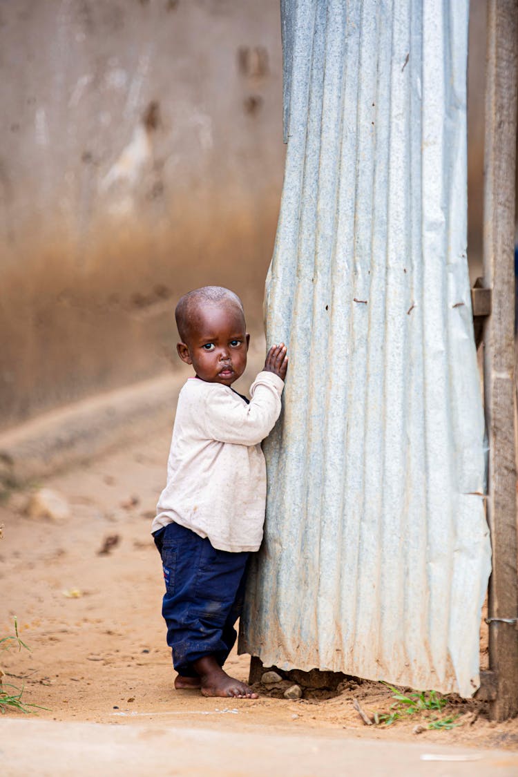 Boy Standing Near Wall