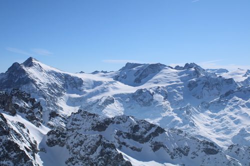Free Stunning view of snow-covered mountains under clear blue skies in Engelberg, Switzerland. Stock Photo