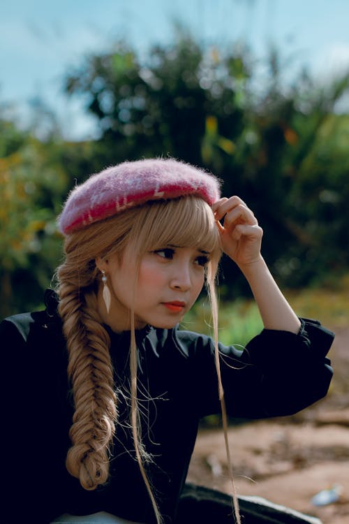 Close-Up Photography of a Woman With Braided Hair