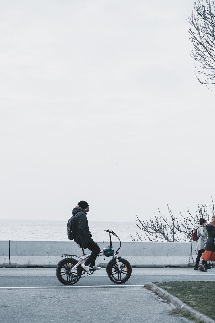 Person On A Bicycle On An Asphalt Road