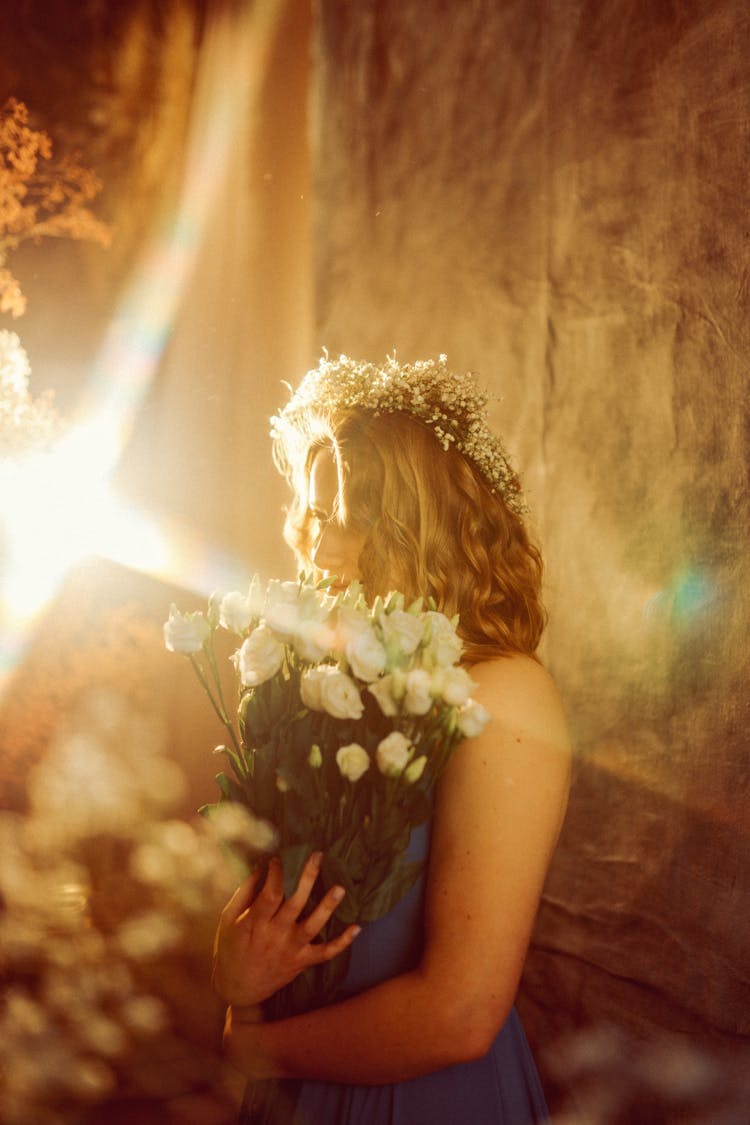 Woman Holding Holding Bunch Of White Roses