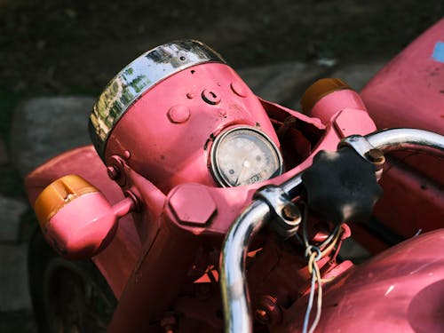 Close Up Photo of a Pink Motorcycle