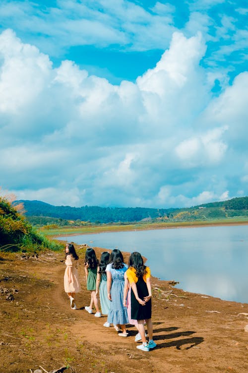 Women Near Calm Body Of Water