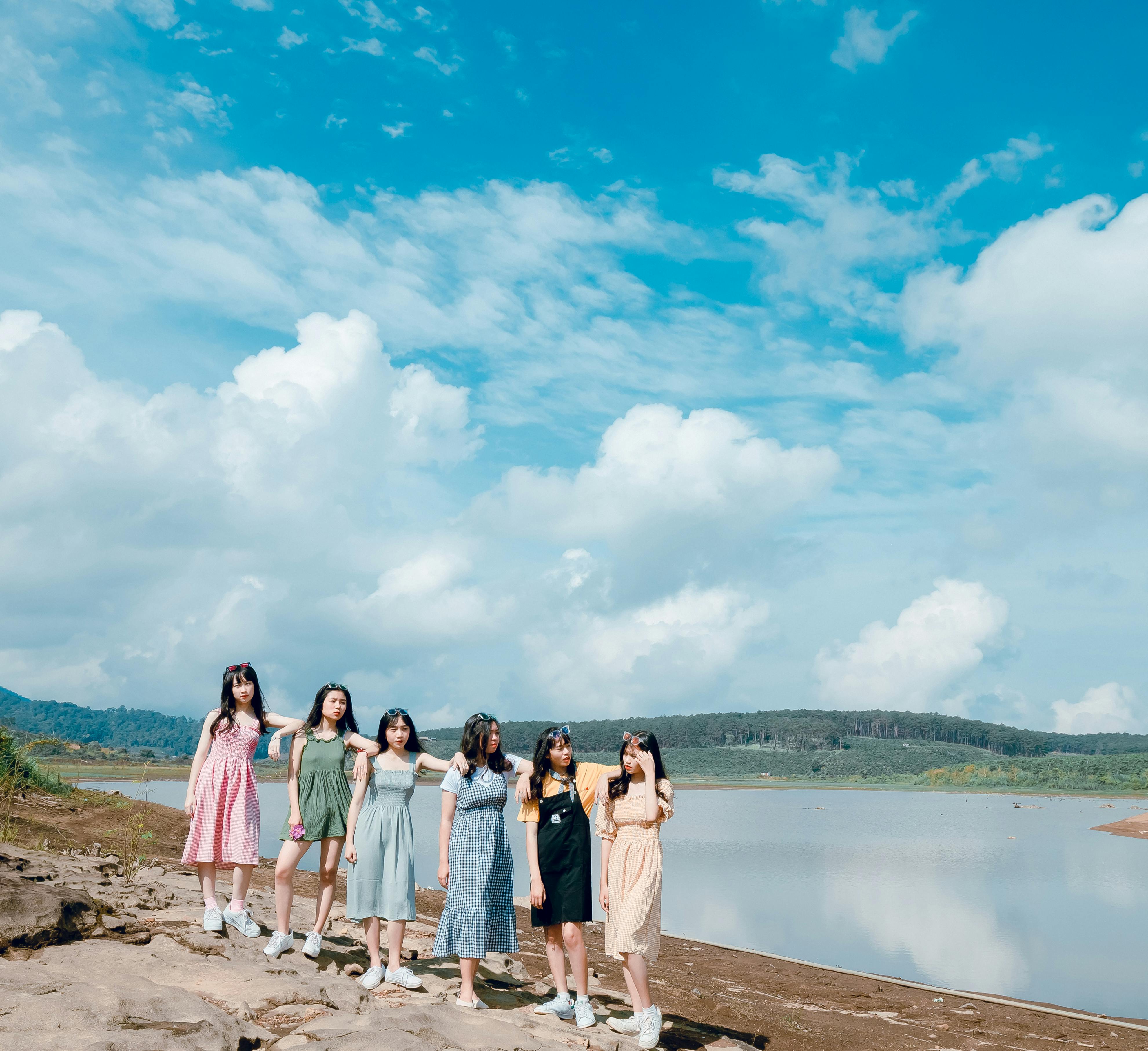 Group of Women Wearing Dress Standing Near Body Of Water \u00b7 Free Stock Photo