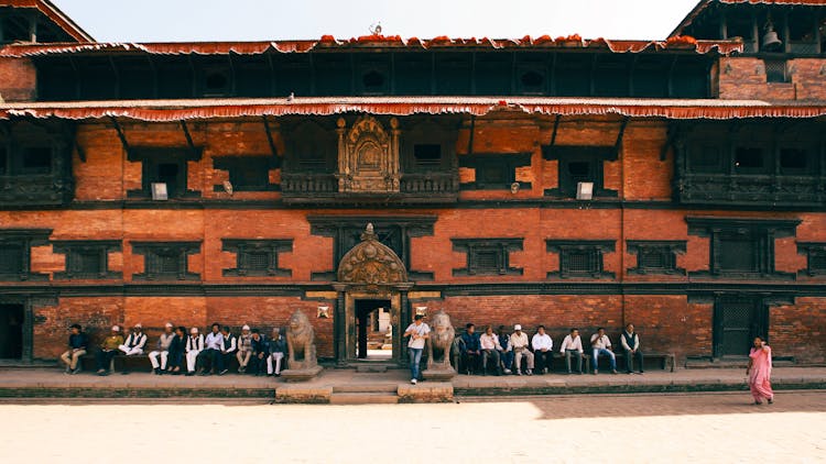 People Sitting By The Entrance To Kumari Ghar In Kathmandu, Nepal