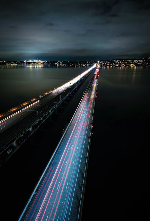 Free Time-Lapse Photo of Vehicles on the Bridge at Night Stock Photo
