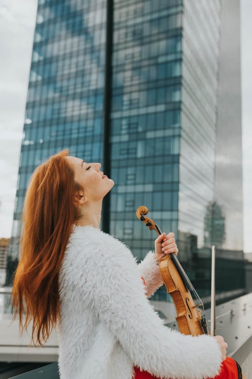 Free Woman Holding a Violin Stock Photo