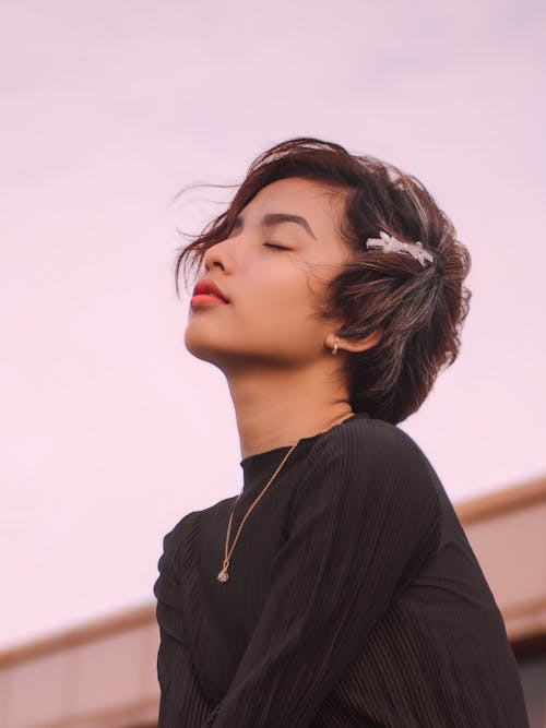 Portrait of Woman in Short Hair Wearing Cute Hairpin