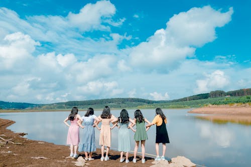 Group of Girls Standing Beside River