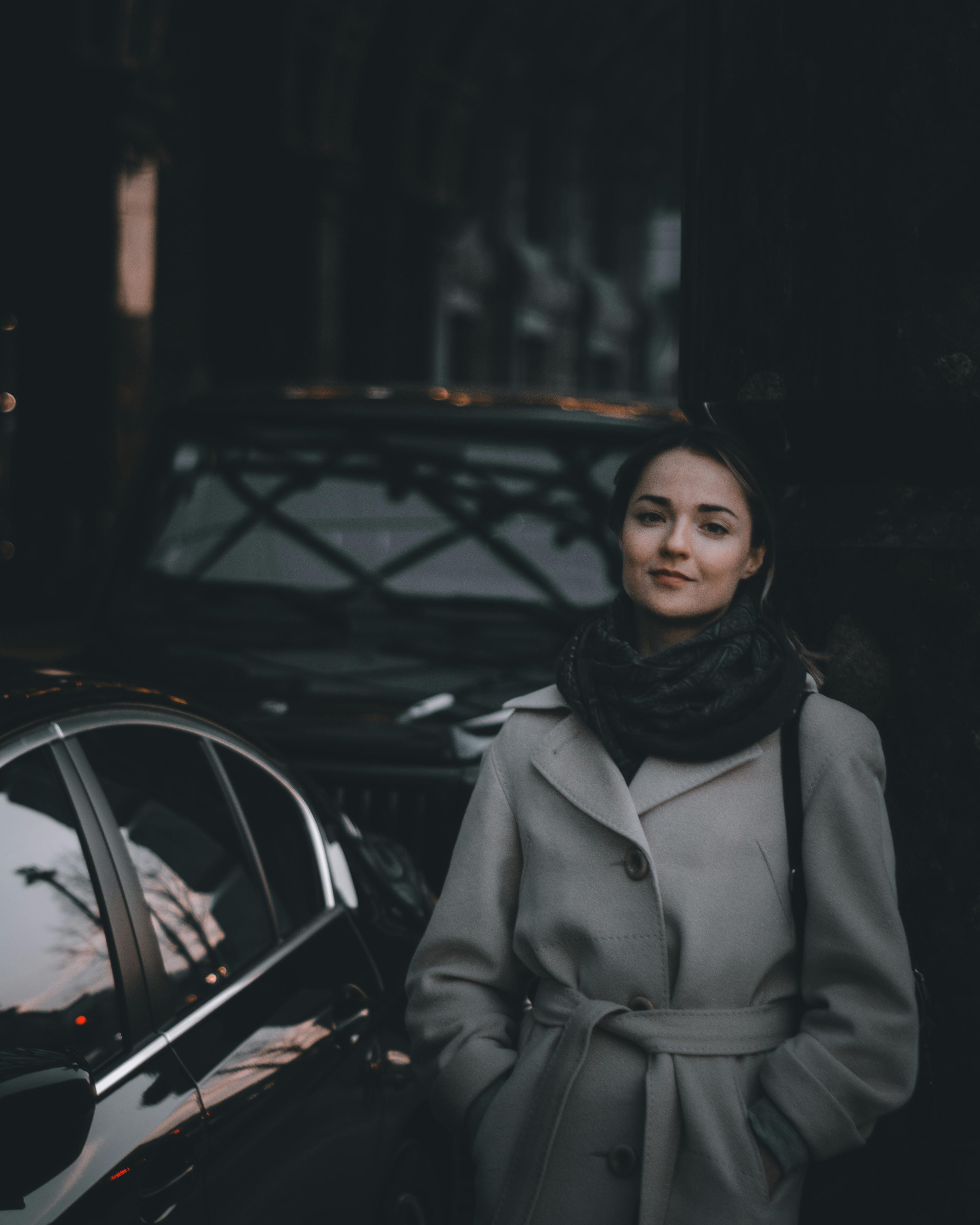 A Pair of Women Wearing Coats Standing on the Road · Free Stock Photo