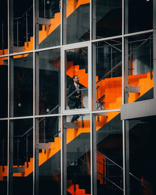 Man Walking Up the Stairs in Office Building 