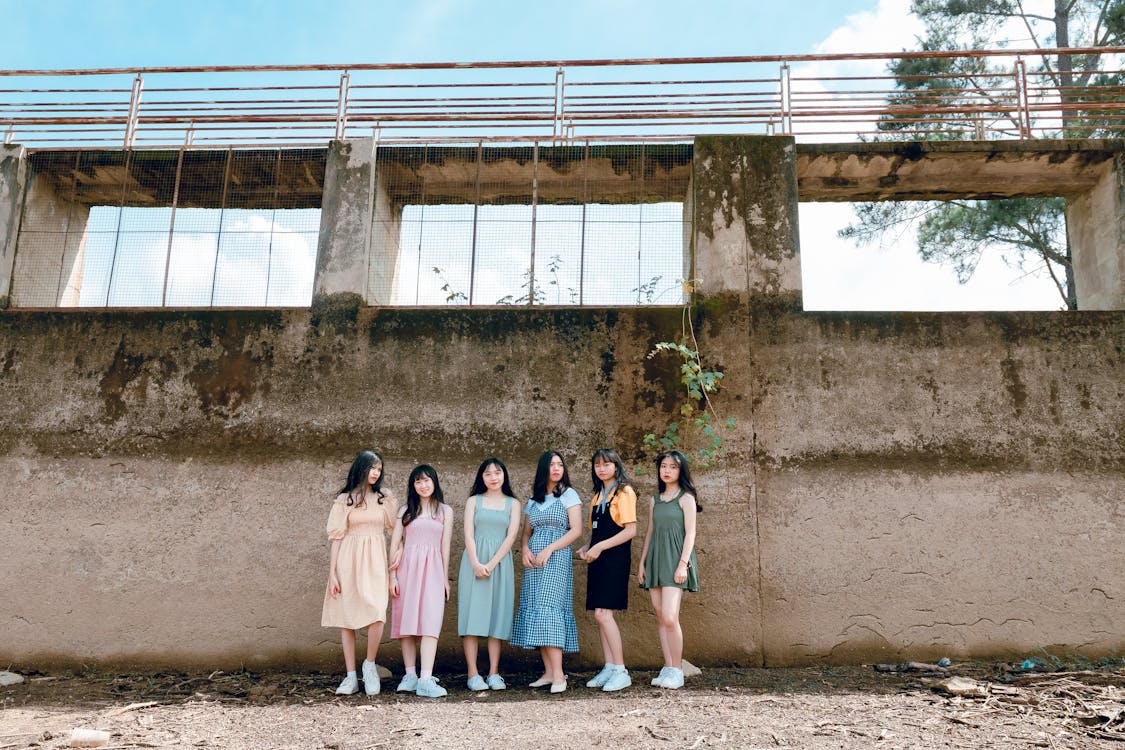 Free Six Women Standing Near Wall Stock Photo