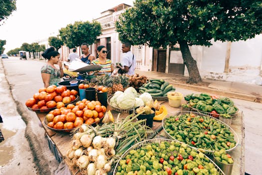 Vibrant city street market with diverse fresh fruits and vegetables on display.