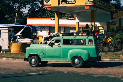 Green Truck at Gas Station