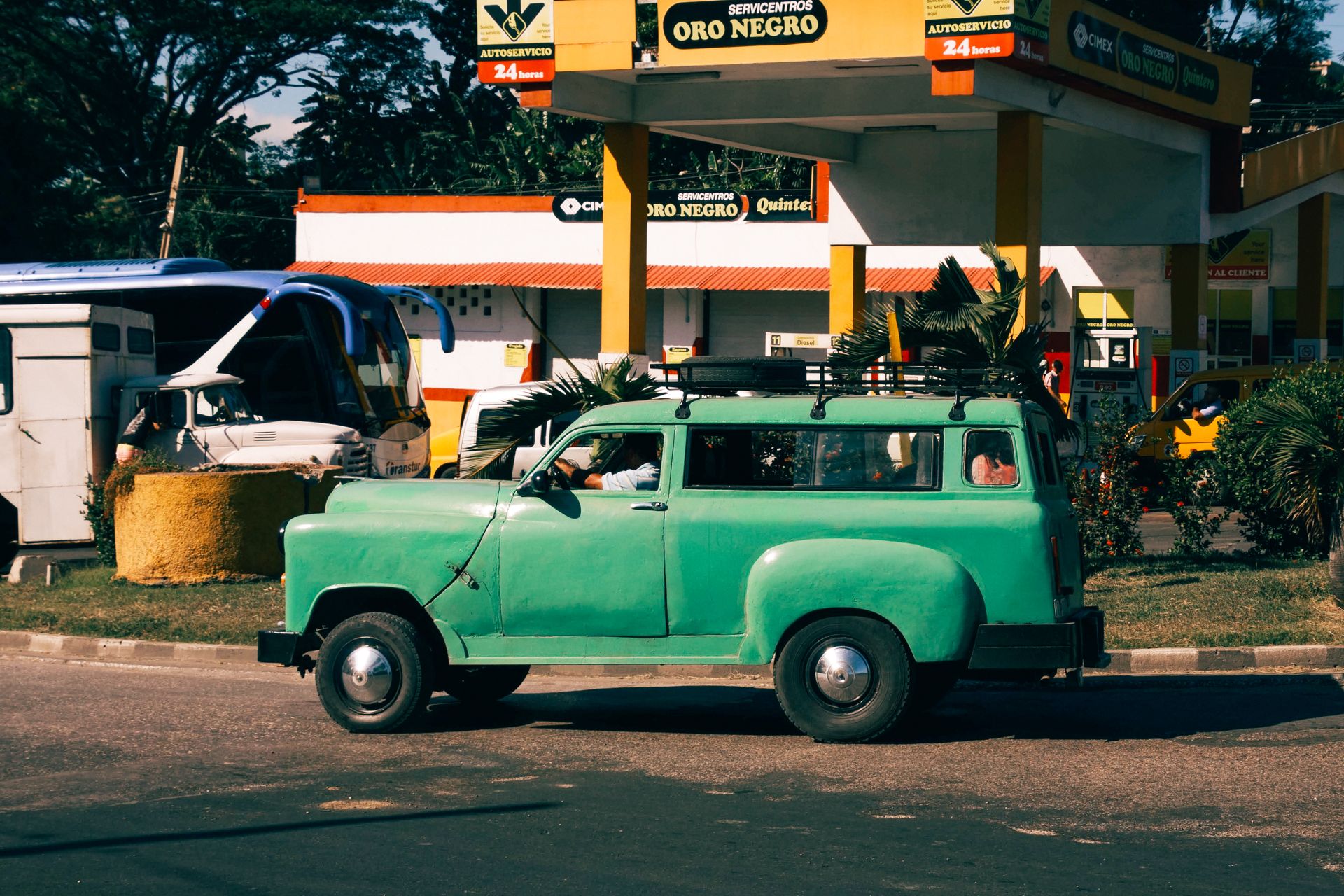 Green Truck at Gas Station