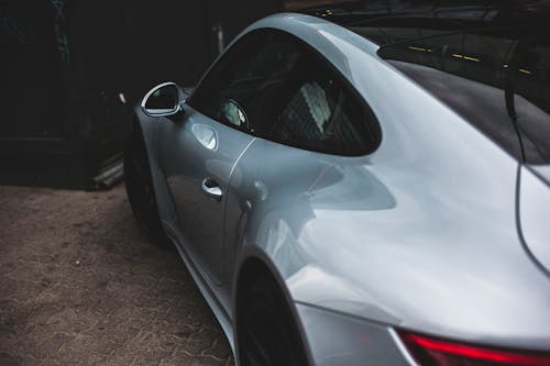 Close-Up Photography of Silver Sports Car