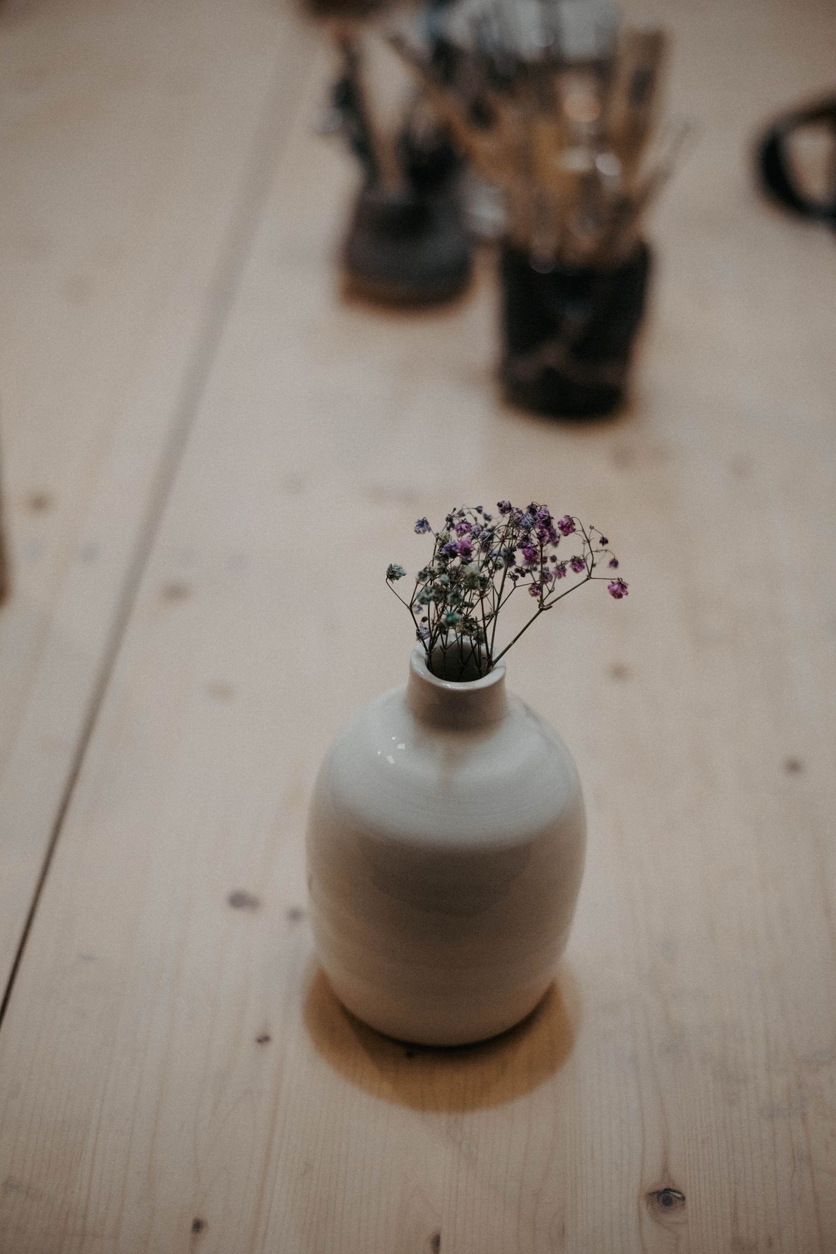 Mirena bud vase in bone porcelain holding small flowers