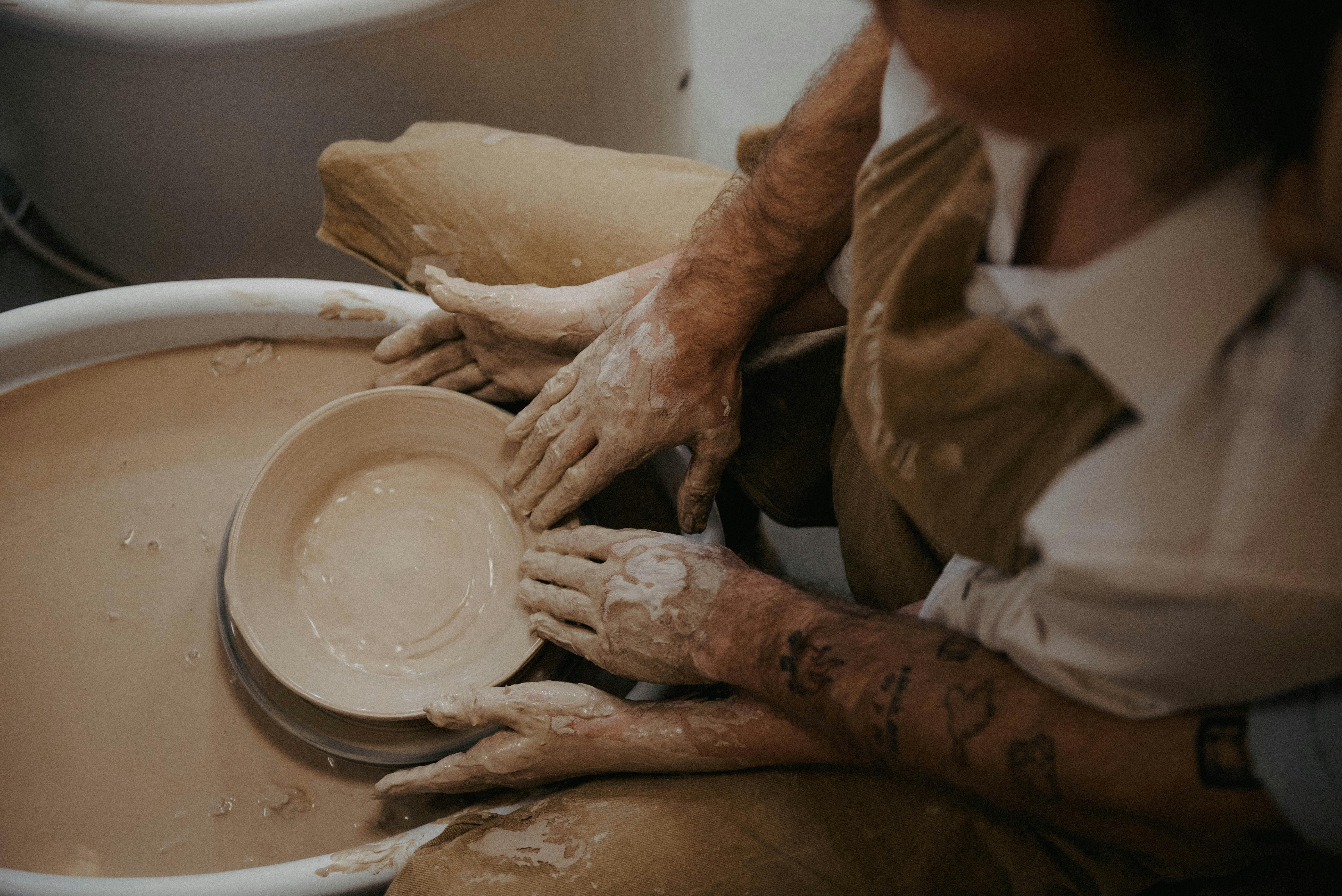 Male potter molding clay Stock Photo by ©Wavebreakmedia 119098896