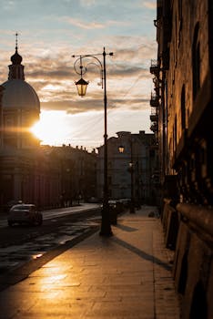 A picturesque street in Russia at sunset, featuring historic architecture and warm lighting.