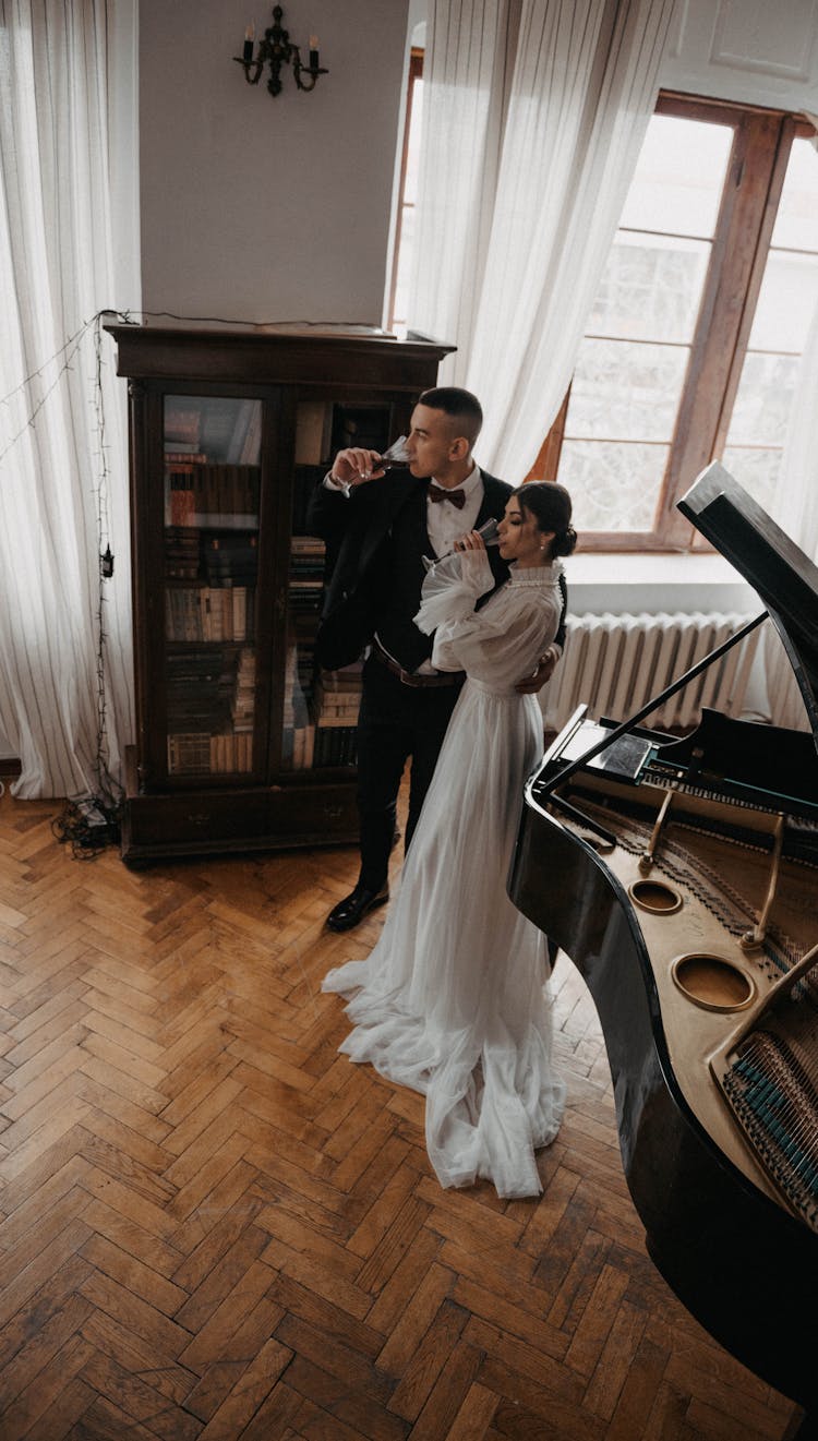 A Man And Woman Drinking Champagne