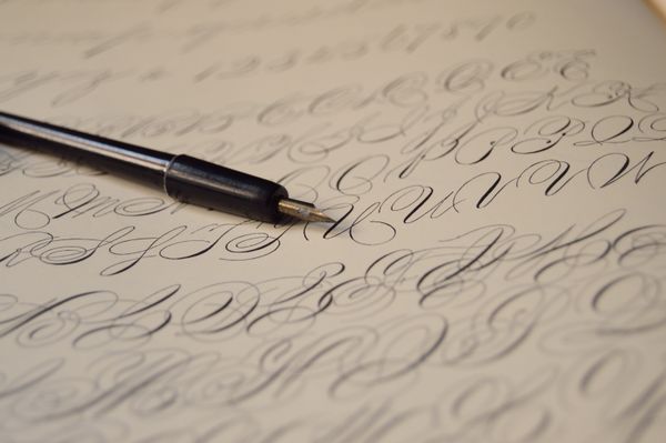 Flourished script written with a fountain pen — photo by Miguel A. Padrinan on Pexels