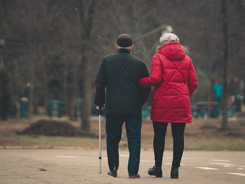 Woman and Man with Walking Stick