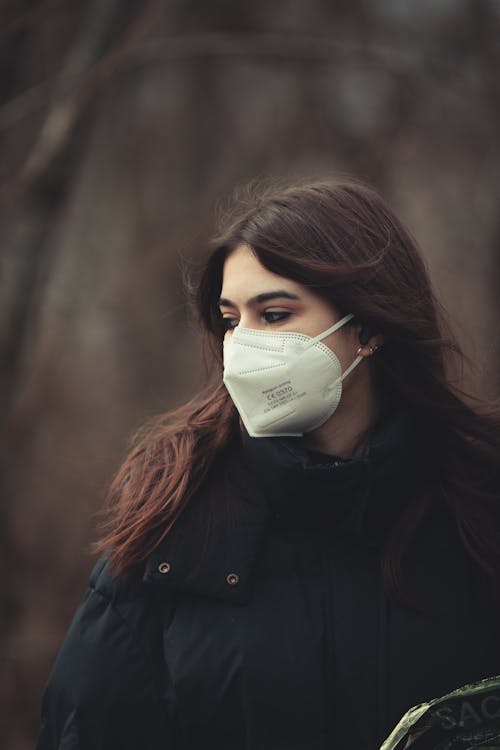 Woman in Black Jacket Wearing a Face Mask