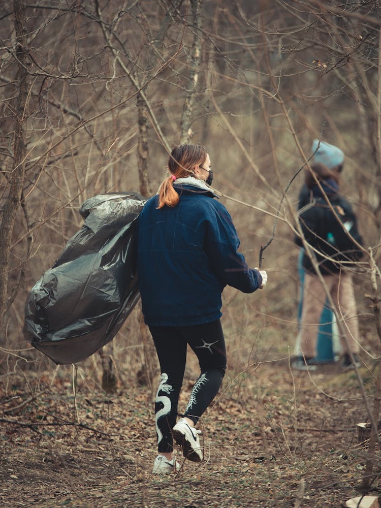 People Cleaning Forest From Garbage