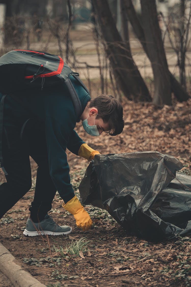 A Man Cleaning The Forest