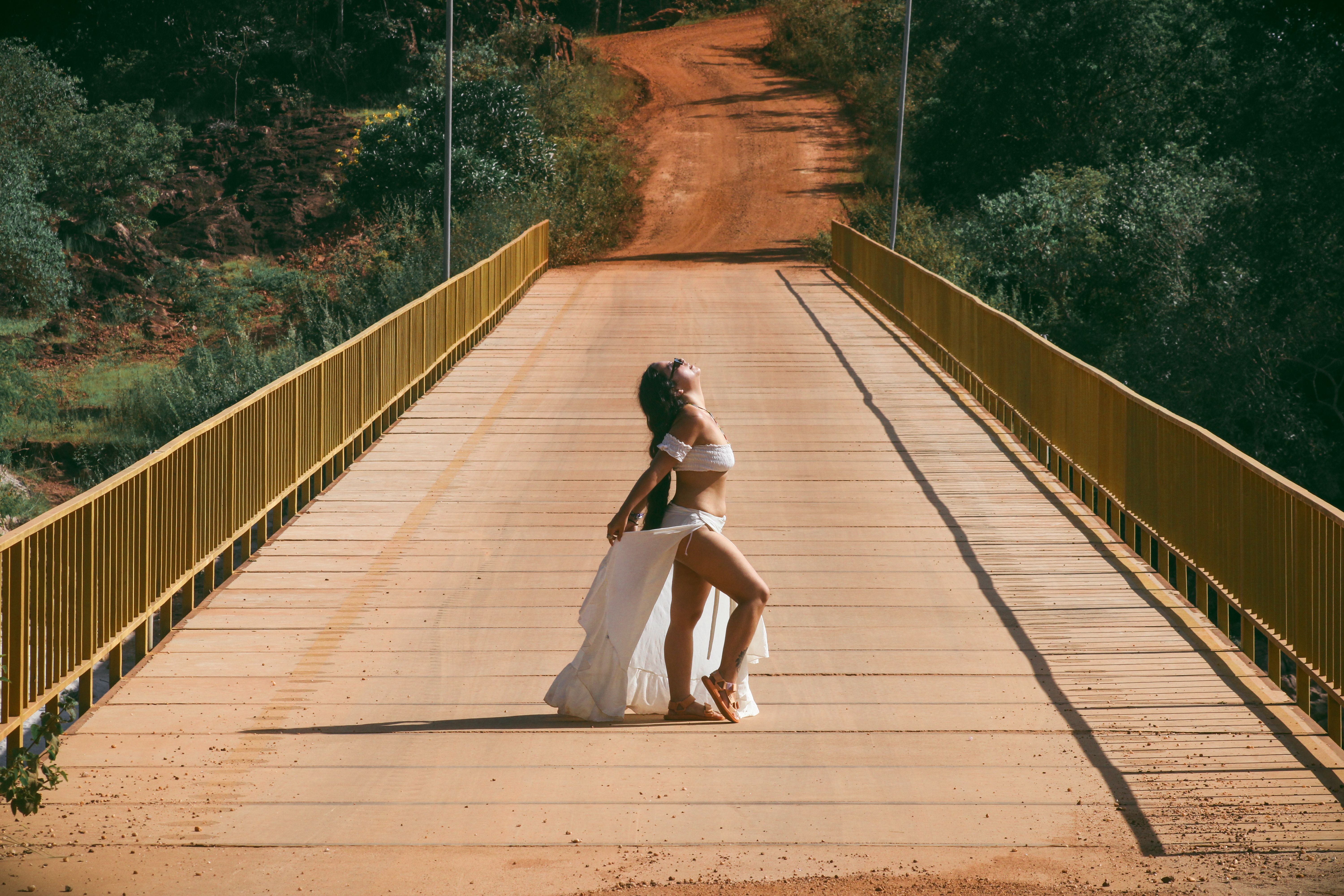 A Woman Posing on the Wooden Bridge · Free Stock Photo