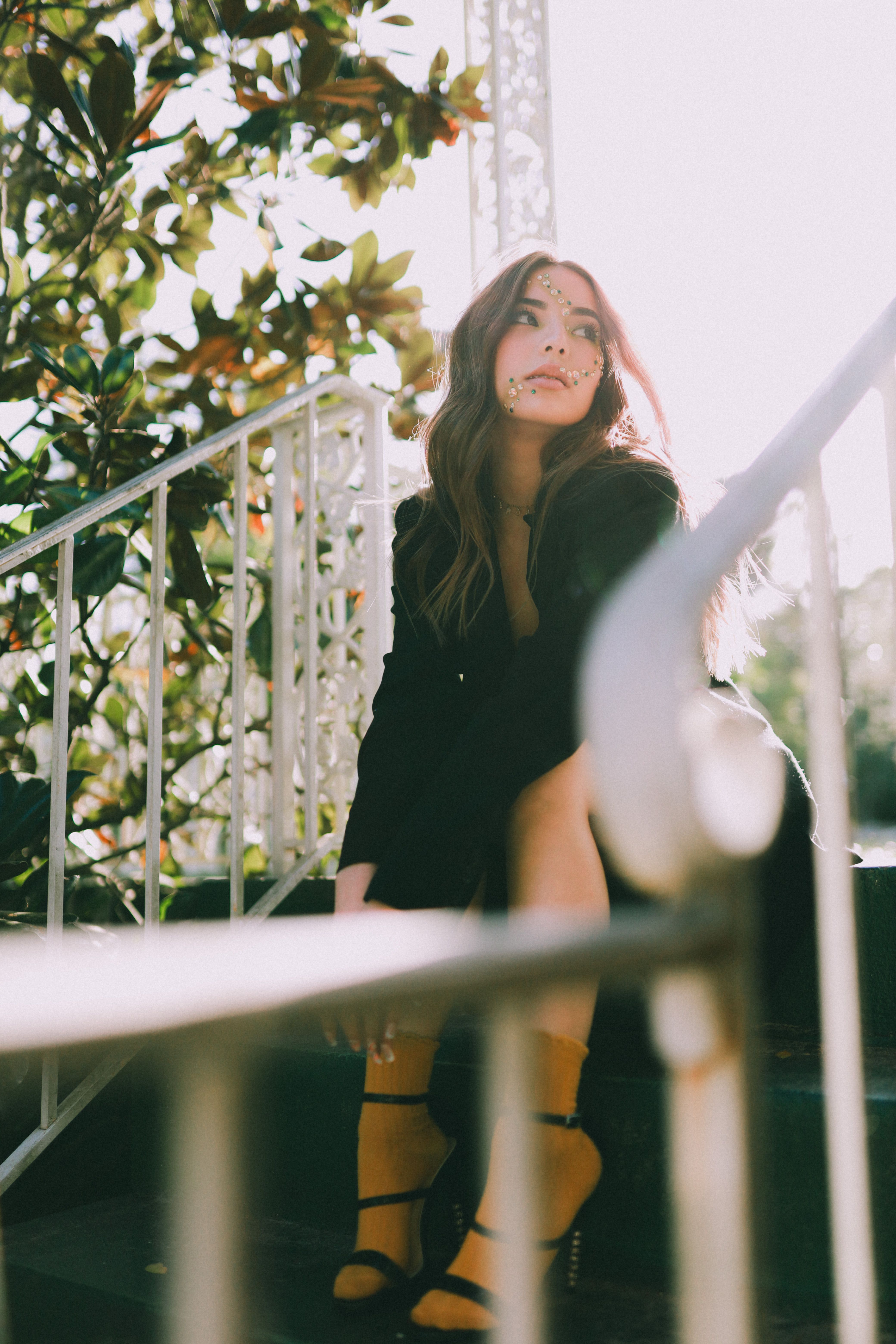 Woman Wearing a Trench Coat Sitting on Stairs · Free Stock Photo