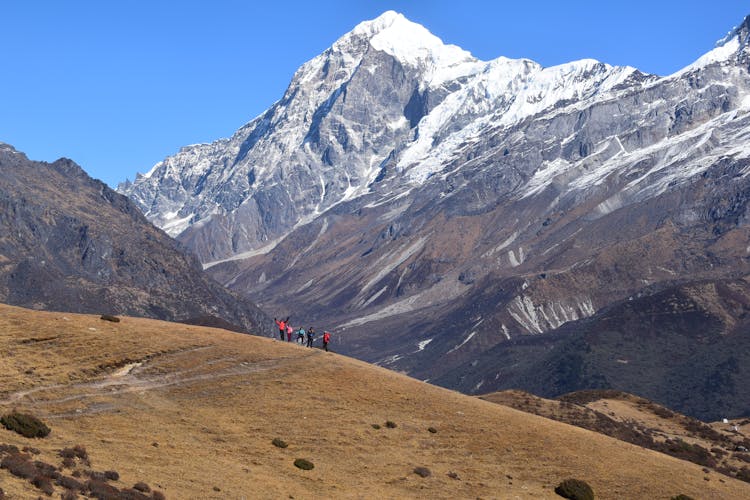 People Hiking In Mountains