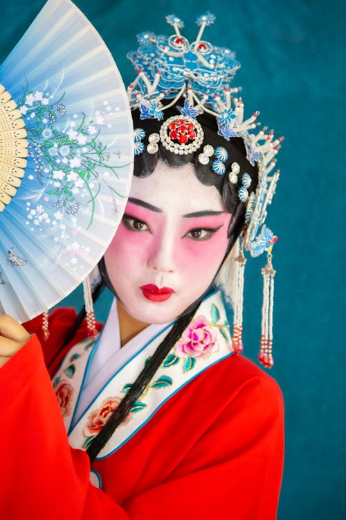 Young Woman Wearing Traditional Chinese Clothing and Makeup 