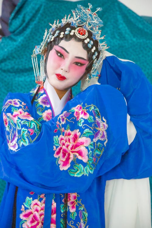 A Woman in Blue Floral Traditional Clothes