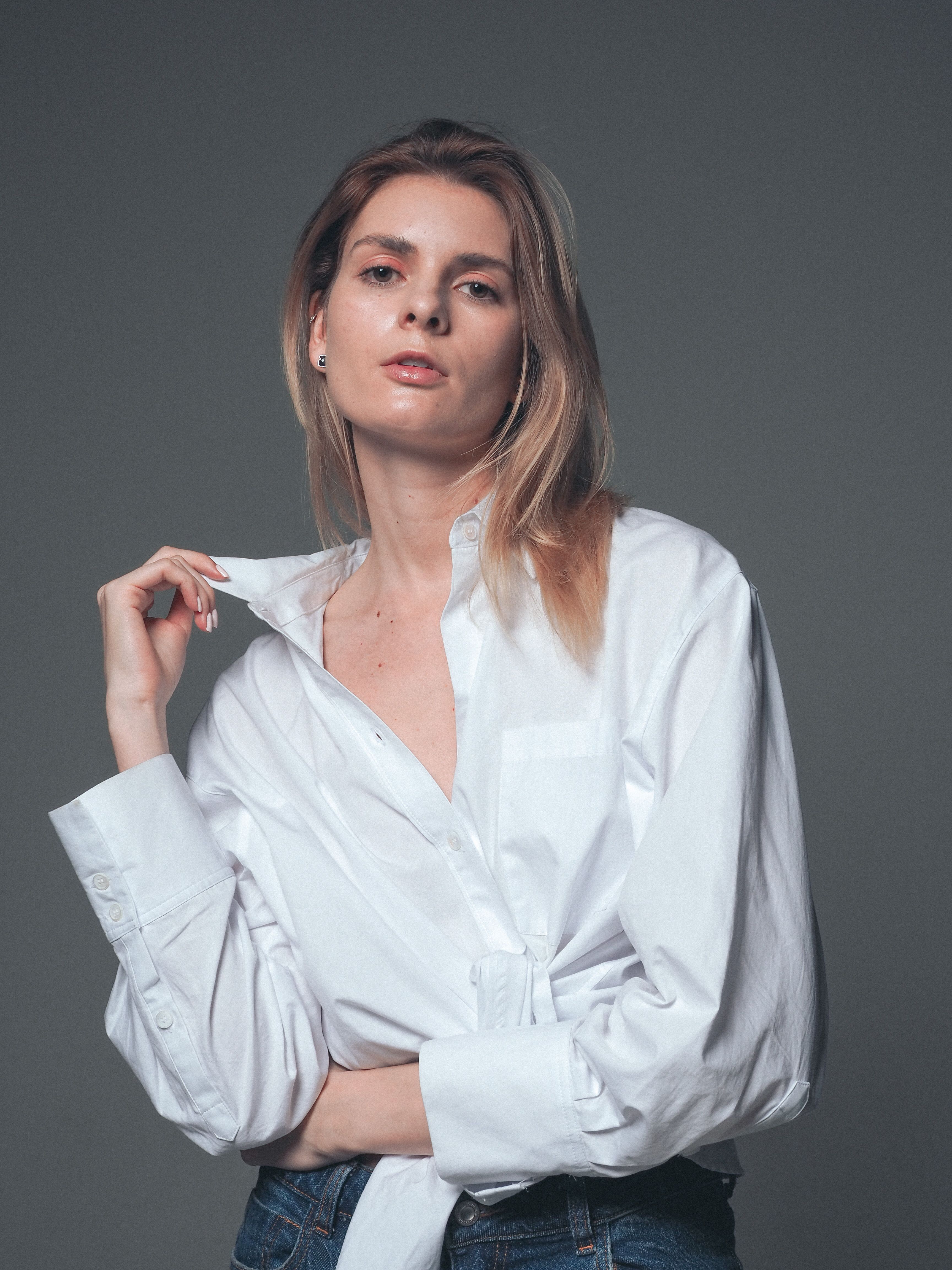 Woman in blouse and jeans, elegant look