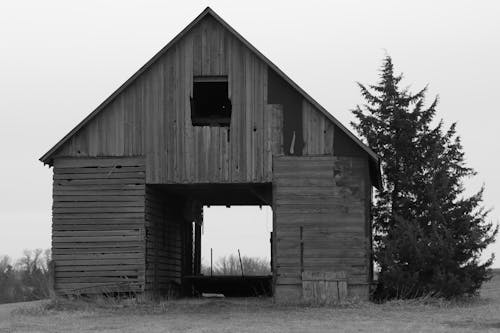 Grayscale Photo of an Abandoned Barn