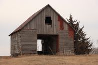 Brown Wooden Barn House on Brown Grass Field