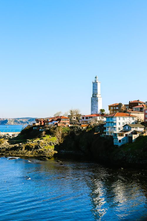 Free Blue skies and sea surround the historic Rumelian Lighthouse on the Turkish coastline. Stock Photo