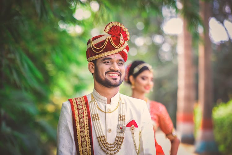 Happy Groom Wearing A White Sherwani