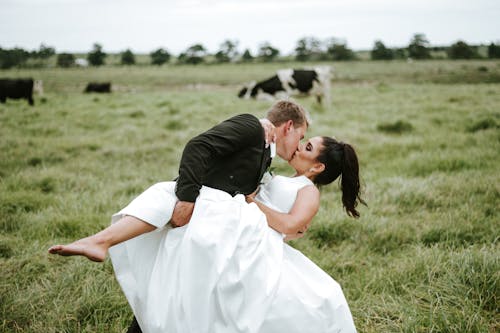 Bridegroom Dipping His Bride in Kiss