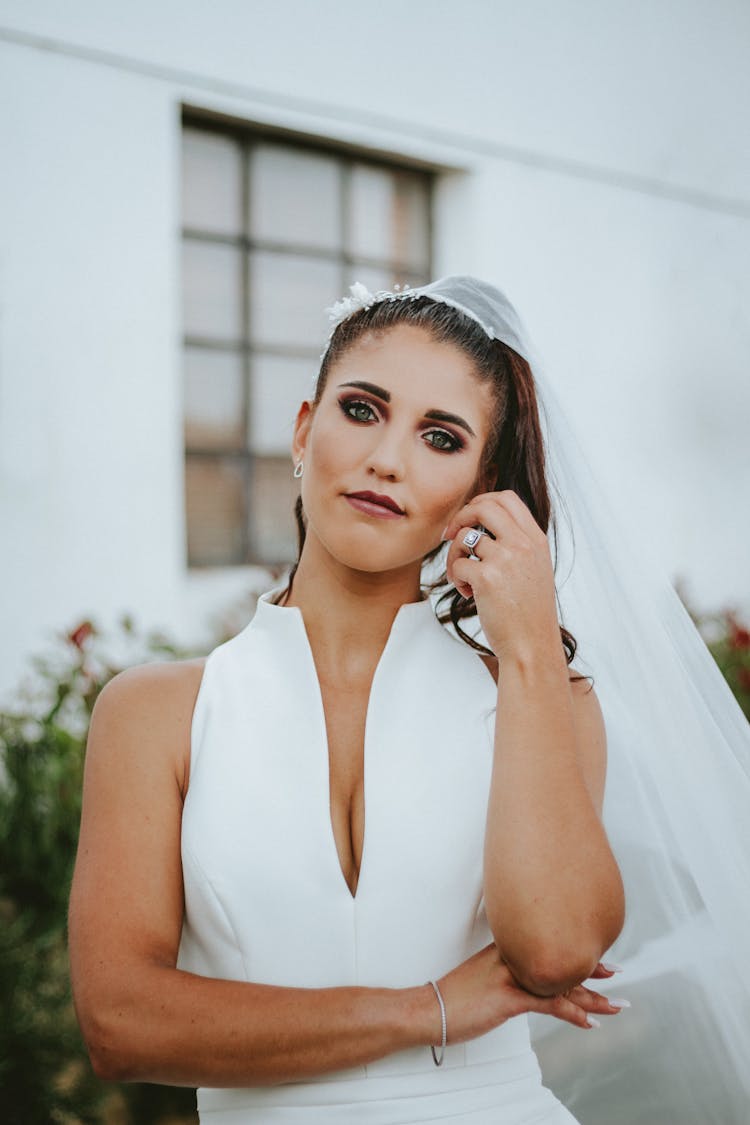Portrait Of Bride Posing With Hand Touching Face