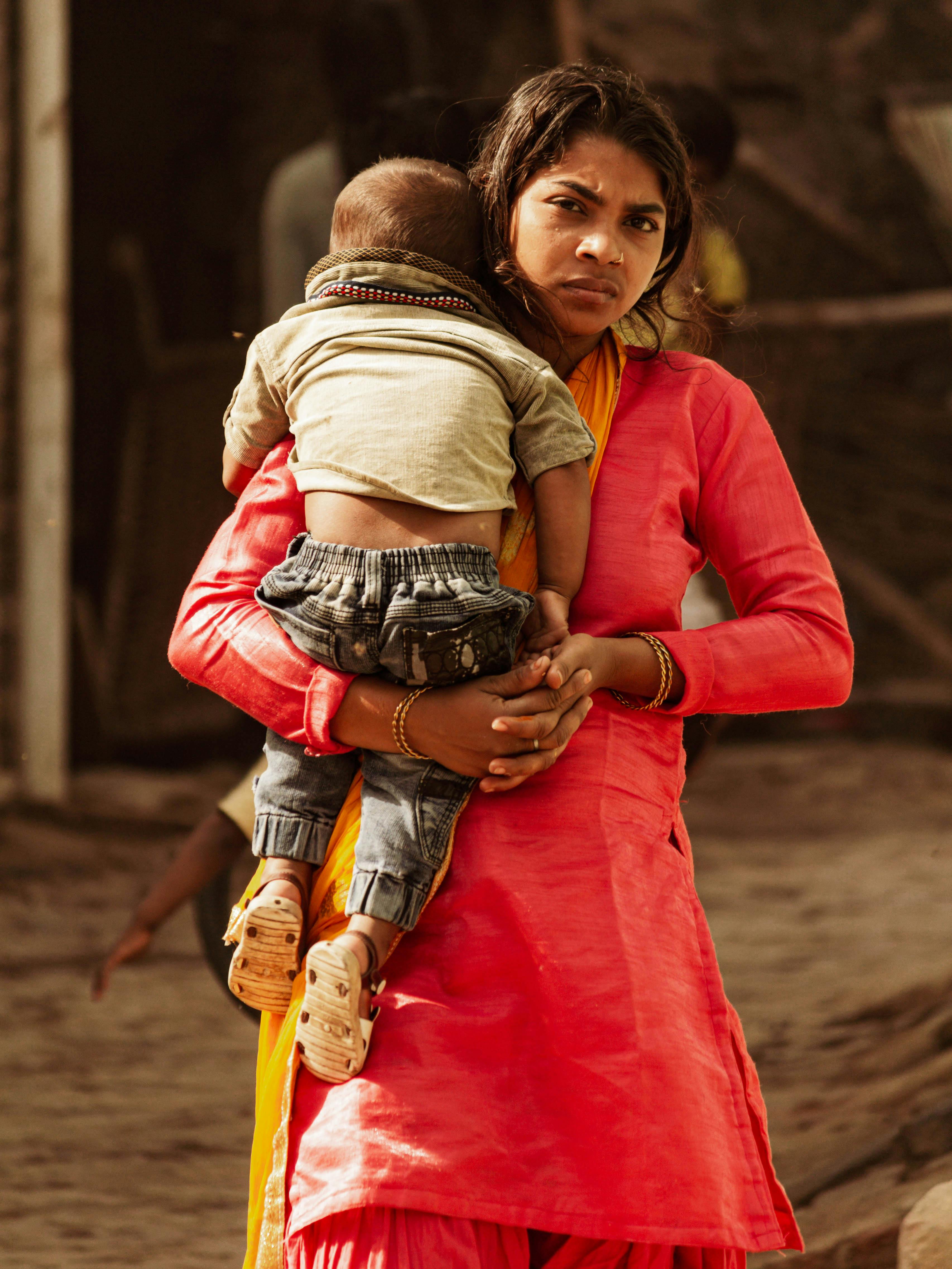 woman carrying a child