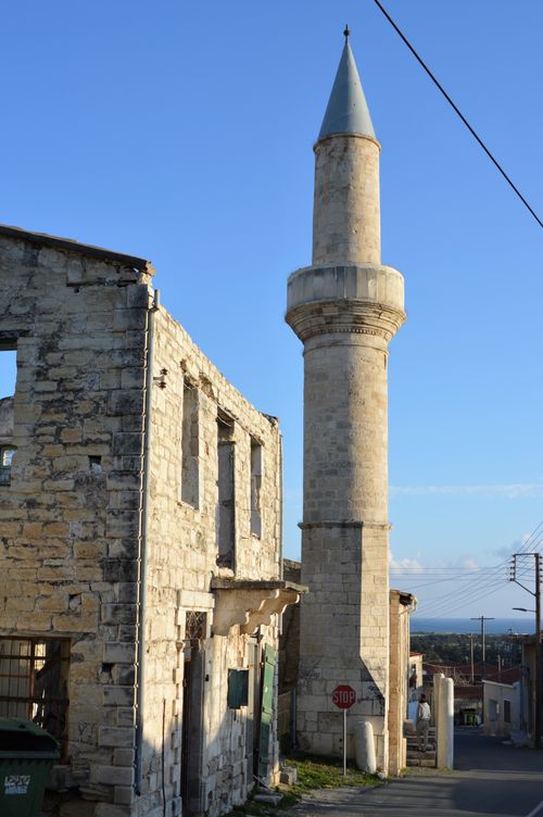 Free Old disused Mosque with Stop sign and derelict building Stock Photo
