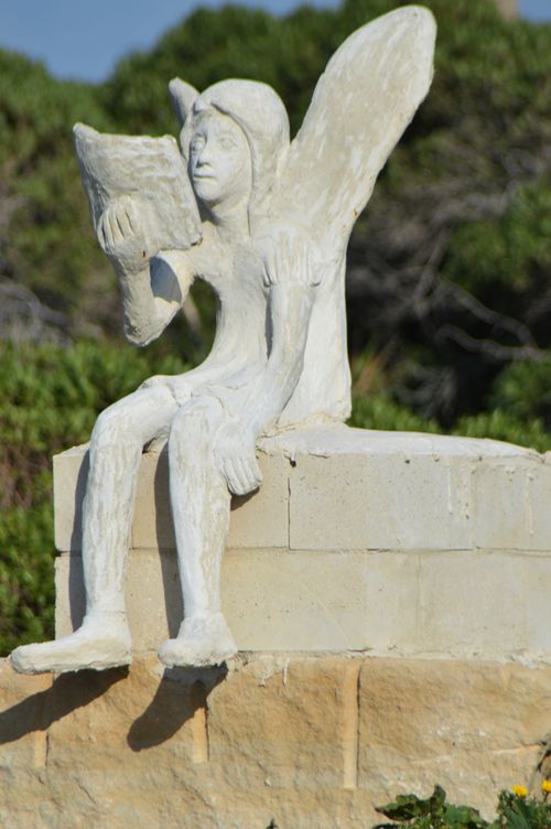 Free Statue of angel or fairy reading a book Stock Photo