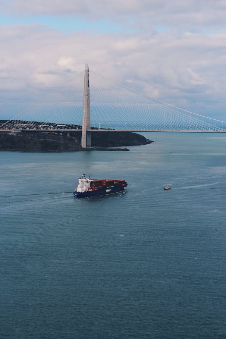 A Cargo Ship Sailing On The Sea Near Yavuz Sultan Selim Bridge