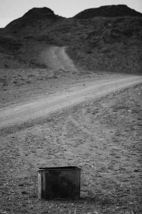 Grayscale Photo of a Metal Container 
