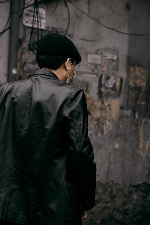 Free Back View of a Man Wearing a Black Leather Jacket Stock Photo