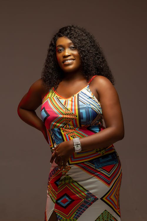 Portrait of Woman with Curly Hair and Colorful Dress