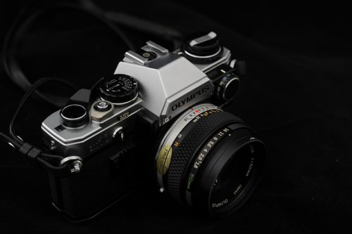 Free Close-up of a classic vintage Olympus film camera featuring a lens and equipment details. Stock Photo